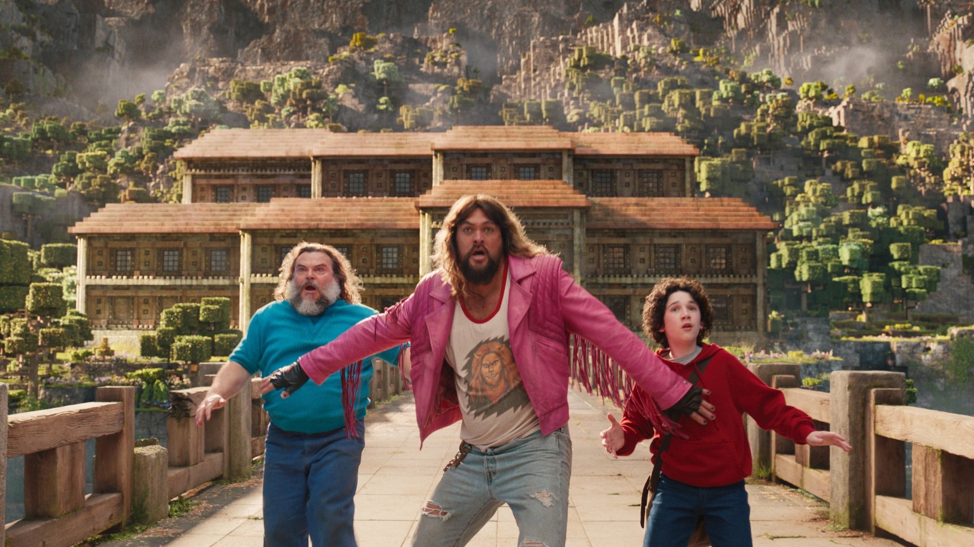 Jack Black as Steve, Jason Momoa as Garrett, and Sebastian Hansen as Henry in “A Minecraft Movie."