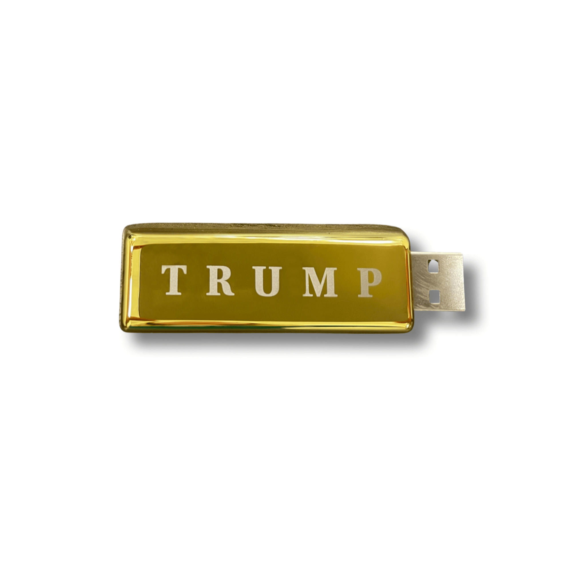 A gold USB drive with the word "Trump" engraved on the side.