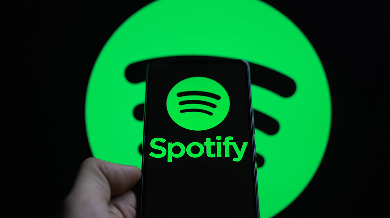 The Spotify logo is being displayed on a smartphone with the Spotify icon visible in the background in this photo illustration on Feb. 11, 2024 in Brussels, Belgium.
