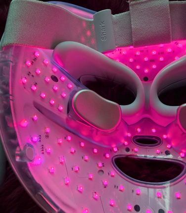 Inside of Shark CryoGlow face mask lit up pink