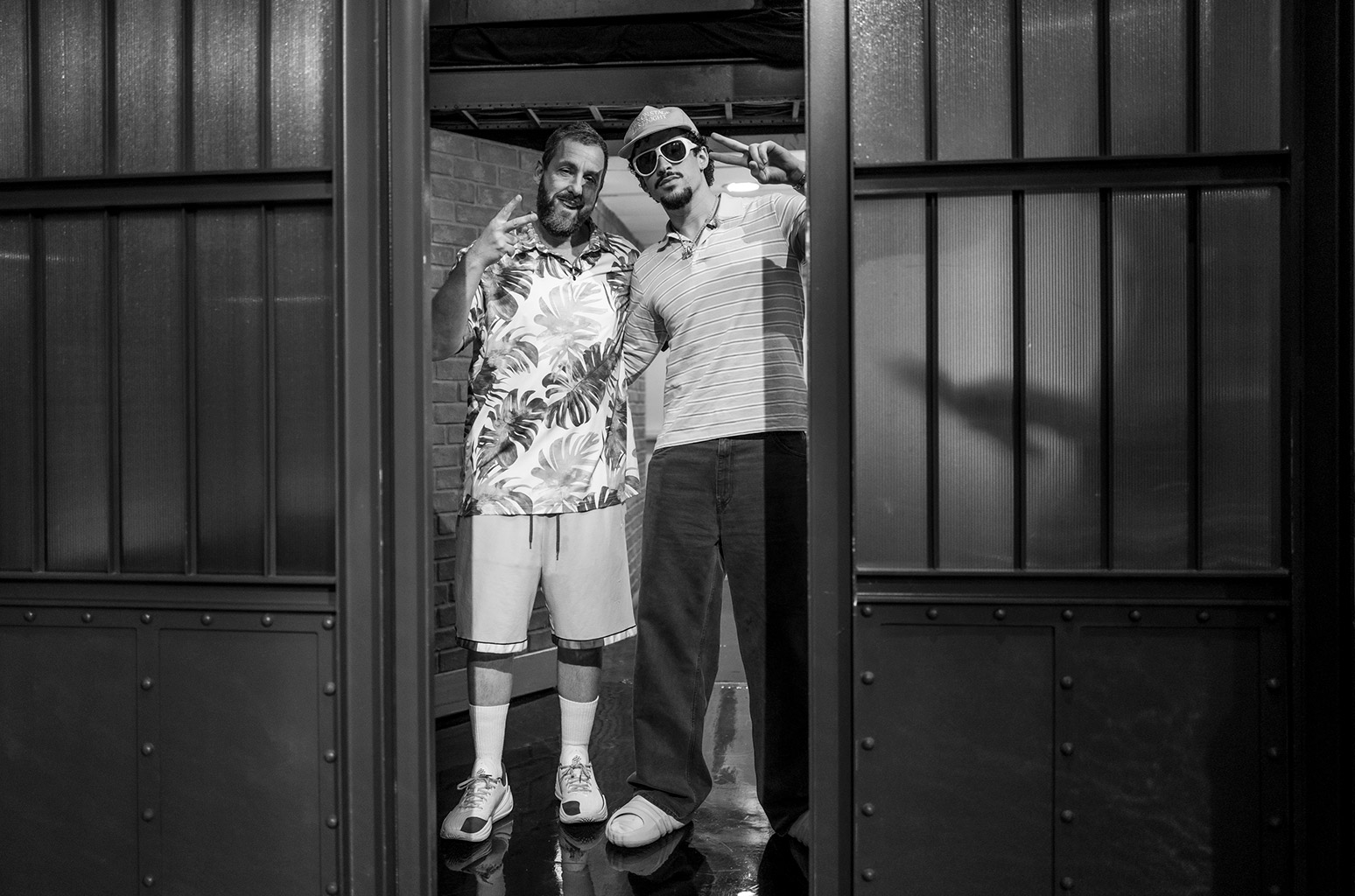 LATE NIGHT WITH SETH MEYERS -- Episode 1677 -- Pictured: (l-r) Comedian/actor Adam Sander and rapper Bad Bunny arrive on July 22, 2025 -- (Photo by: Lloyd Bishop/NBC)