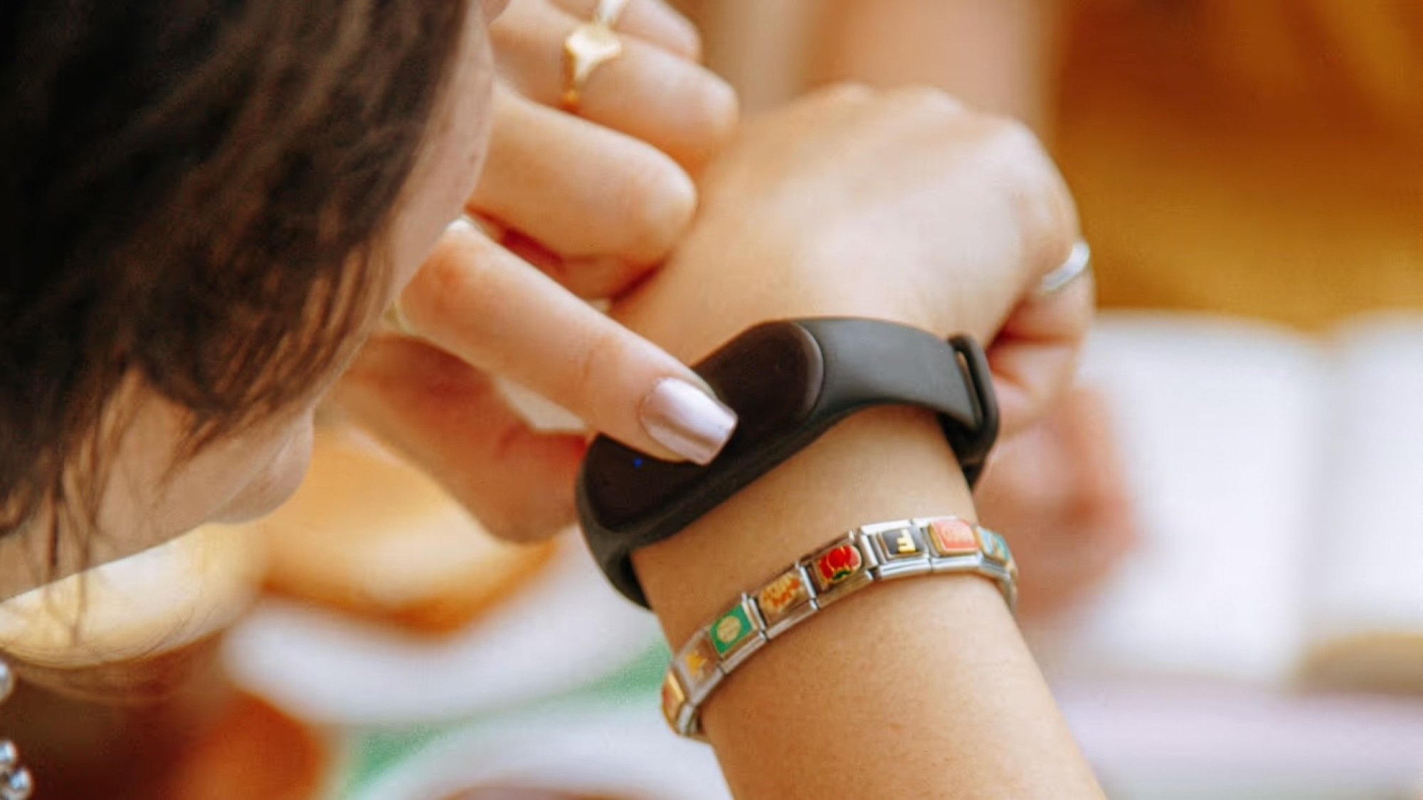 close-up of bee ai device on woman's wrist