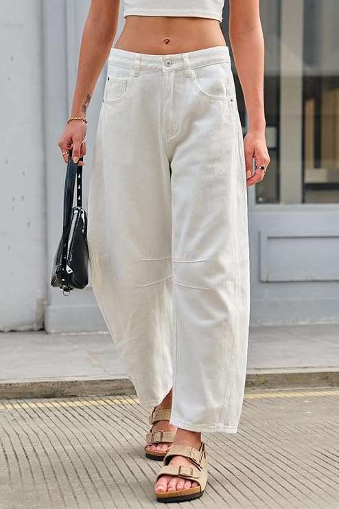 model wearing white barrel jeans with sandals