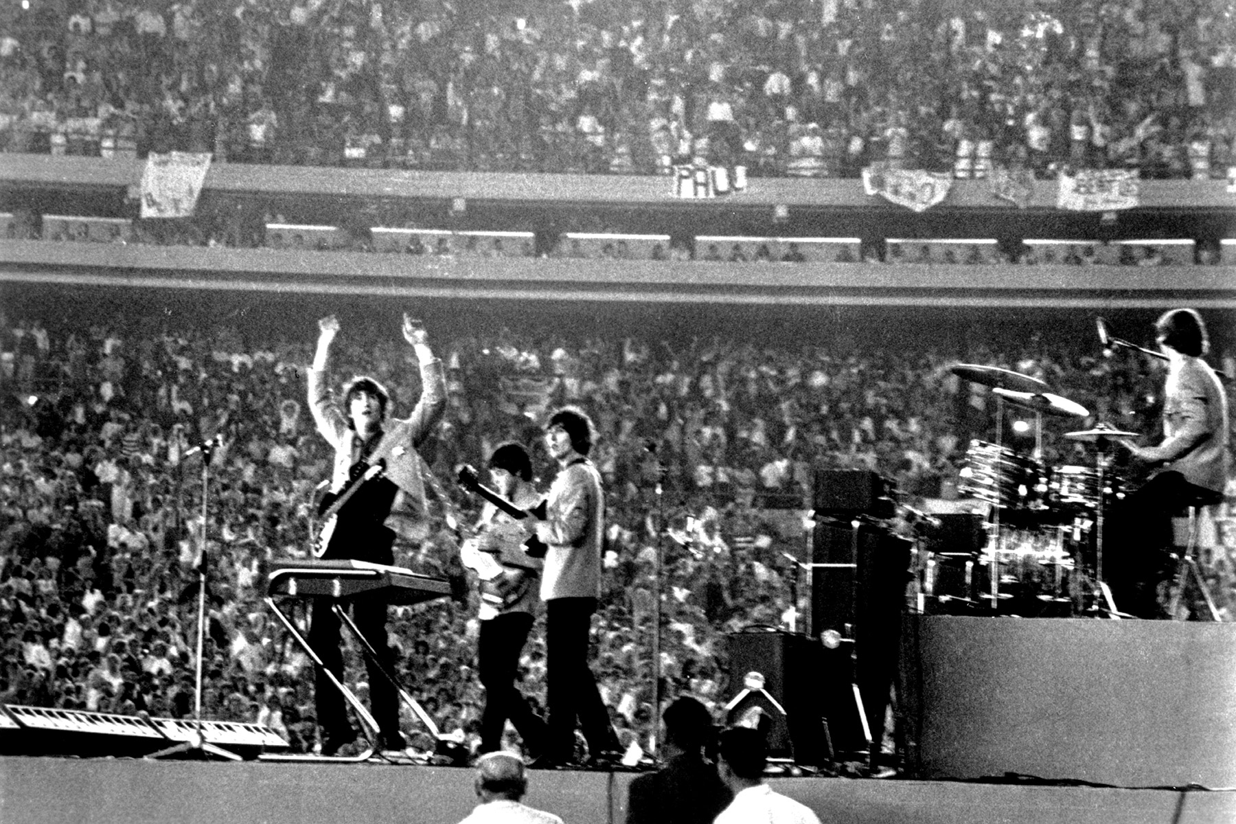 The Beatles perform at Shea Stadium, New York on 15th August 1965.