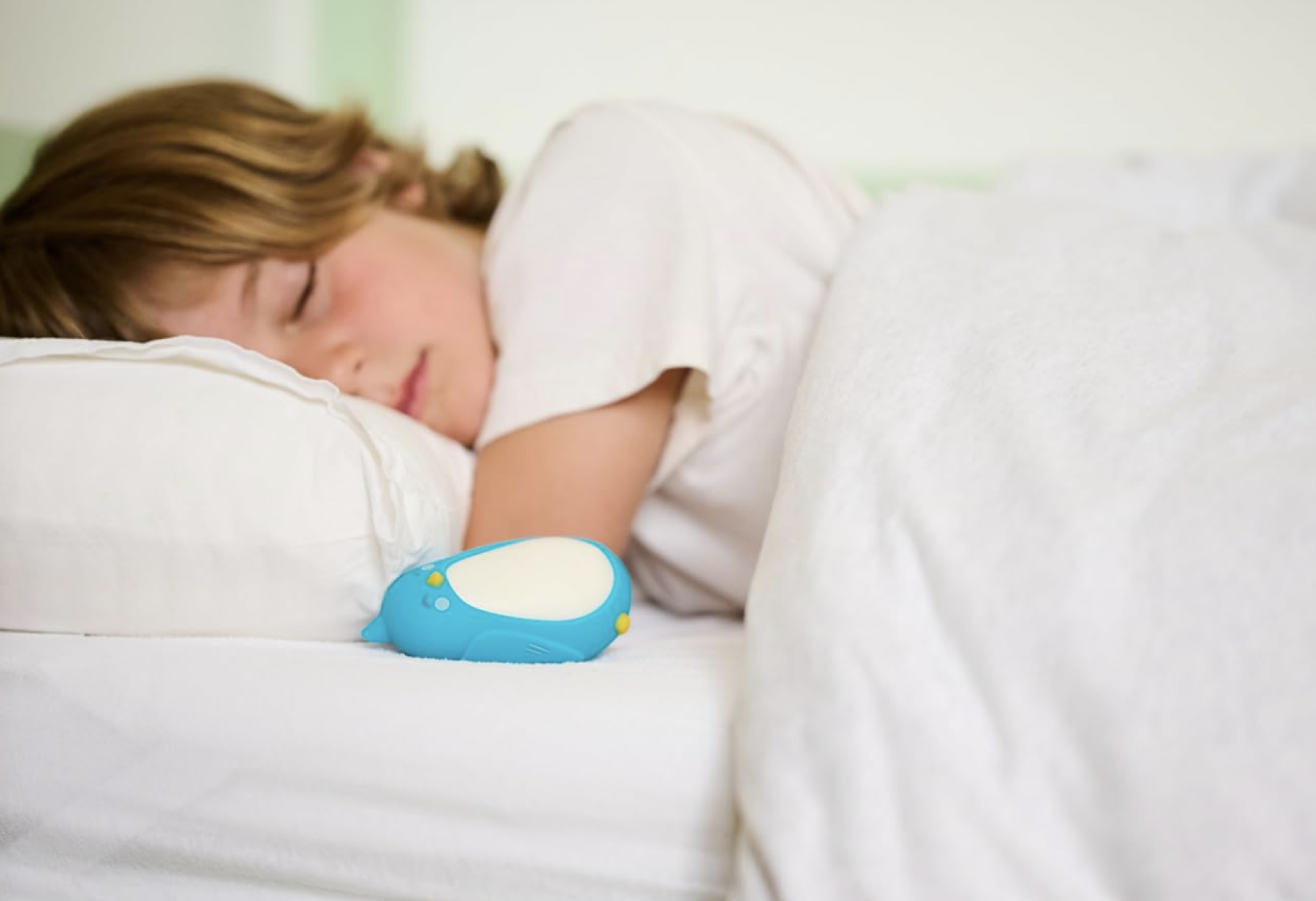 Moonbuddy next to sleeping child