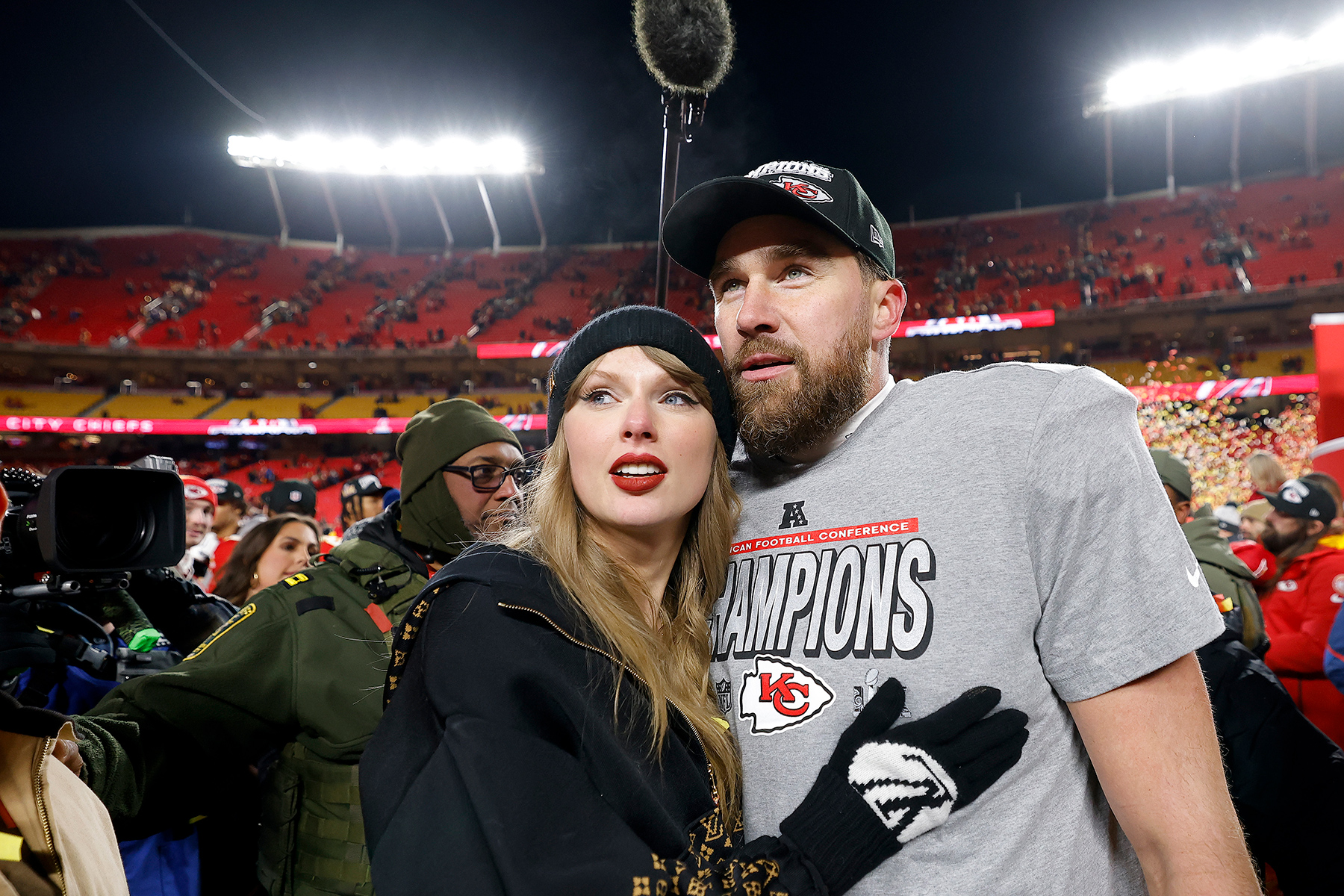 Taylor Swift celebrates with Travis Kelce #87 of the Kansas City Chiefs after defeating the Buffalo Bills 32-29 in the AFC Championship Game at GEHA Field at Arrowhead Stadium on January 26, 2025 in Kansas City, Missouri.  (Photo by David Eulitt/Getty Images)