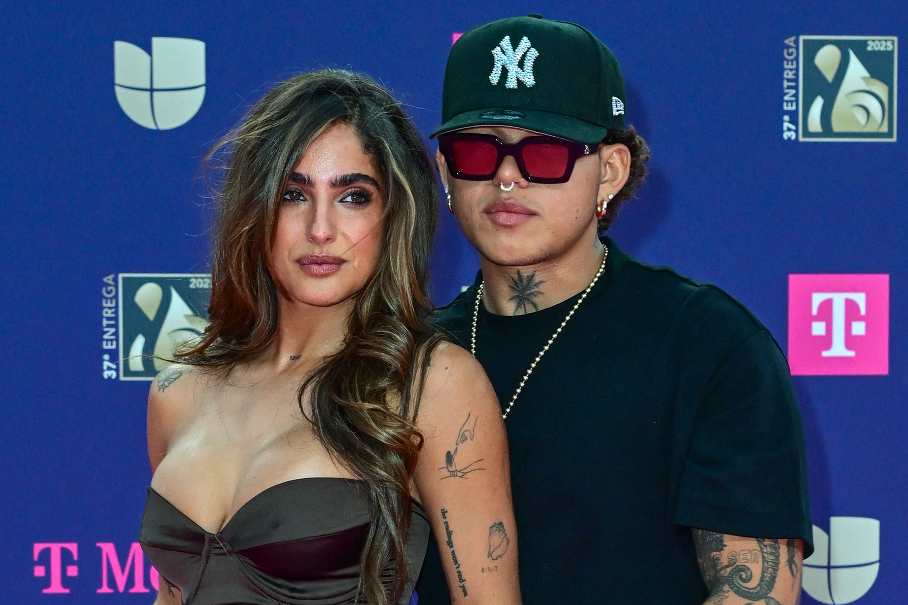 Venezuelan personality Isabella Ladera (L) and Colombian singer Beéle arrive for Univision's 37th Premio Lo Nuestro at the Kaseya Center in Miami, Florida, on February 20, 2025.