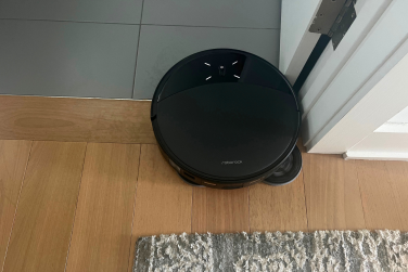 Roborock Saros 10R robot vacuum mopping near wall edge and door